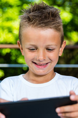 Happy boy with tablet