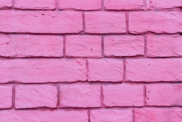 Obraz premium Brick wall of bricks purple streaks