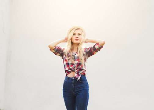 beautiful hipster girl in a plaid shirt