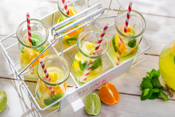 Summer lemonade with orange and lemon