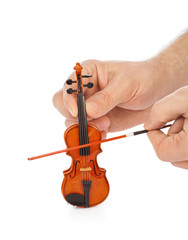 Hands and toy violin