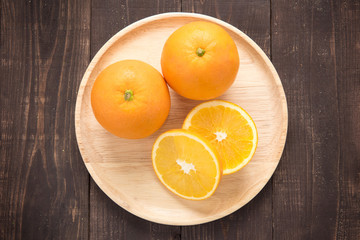 Top view orange fruit on wooden background