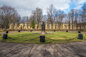 Park with old abandoned fountain, decorated with vintage cannons