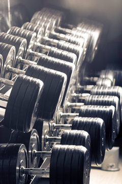 Gym equipment. Sport background. Dumbbell. Copy space
