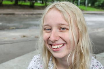 Young blonde girl laughing
