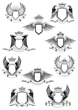 Heraldic winged shields with crowns and ribbon banners