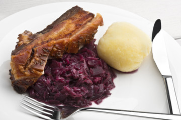 Pork belly roast with sauerkraut and dumplings