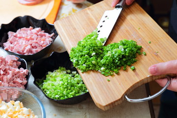 Preparing russian traditional salad Olivier