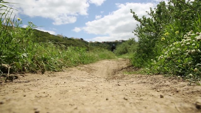 mountain bicycle riding through a country path