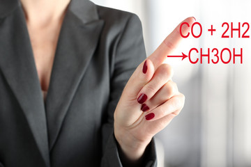 Woman Touching  a chemical formula of methanol