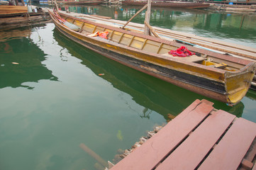 Fototapeta na wymiar wood boat at floating village in Kanchanaburi Province, Thailand