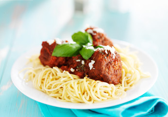 spaghetti and meatballs with parmasan cheese