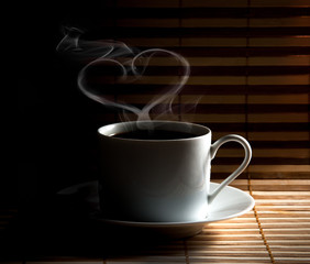 Coffee cup  on old wooden background