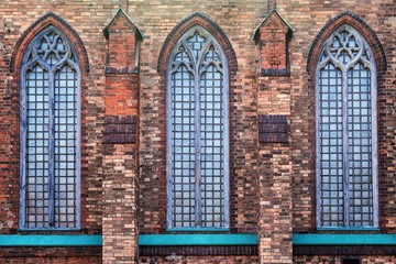 Fototapeta na wymiar brick facade of the old Catholic church
