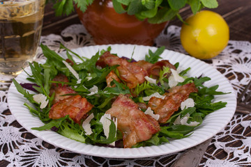 Grilled bacon with parmesan cheese and arugula