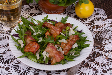 Grilled bacon with parmesan cheese and arugula