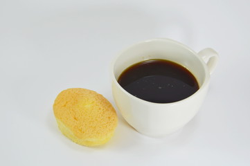 egg cake with cream filling and black coffee