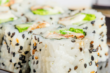 Japanese rolls with sesame seeds close-up shot
