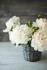 Beautiful peonies in a wicker vase