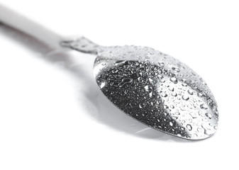 Spoons with water drops