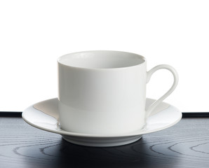 Small white coffee cup isolated on white