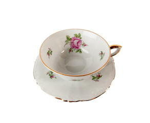 Porcelain teacup and saucer with floral rose ornament