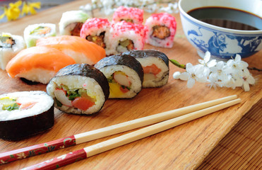 Mix of sushi with wooden chopsticks
