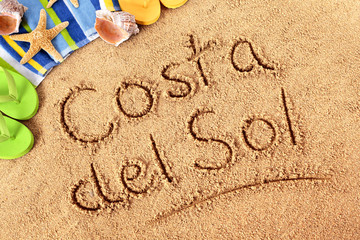 Costa del Sol words written in sand spain spanish summer vacation holiday photo - obrazy, fototapety, plakaty