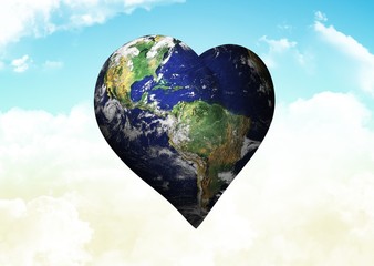 Naklejka premium Composite image of heart shaped earth