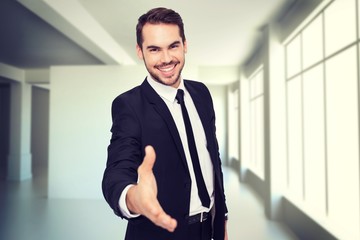 Smiling businessman offering hand