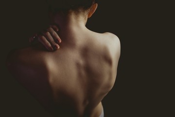 Fototapeta premium Nude woman with a shoulder injury