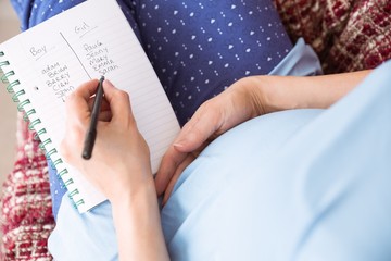 Pregnant woman listing baby names