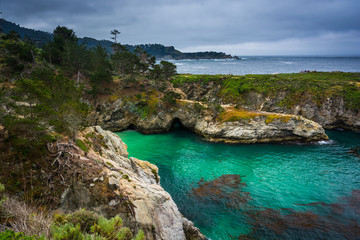 View of beautiful turquoise waters and rocky bluffs at Point Lob