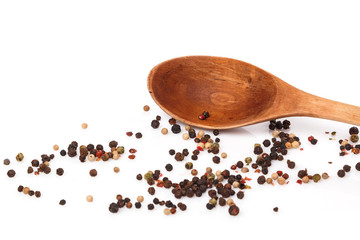 Wooden spoon and dried pepper seeds
