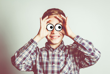 funny little boy with cartoon eyes