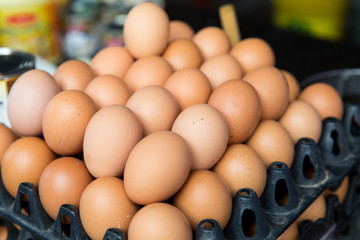 fresh eggs on tray at asian street market