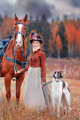 Lady in riding habbit at horse hunting