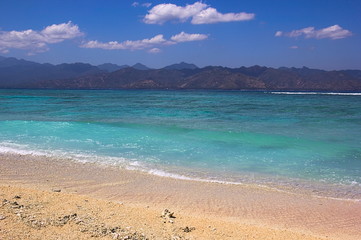 Fototapeta na wymiar Beautiful view from Gili Islands over turquoise ocean to Lombok