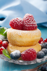 Morning breakfast with mini donuts and berries