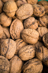 Pile of organic walnuts close up, clean eating concept