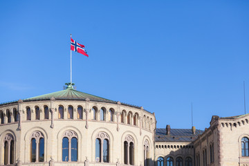 Norwegian flag on parliament building rooftop
