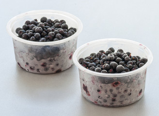 Frozen blueberries close up on white background