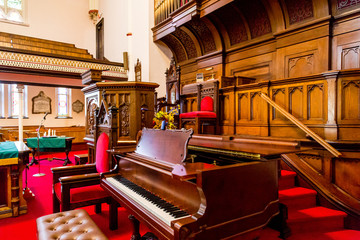 Piano by Altar in Old Church