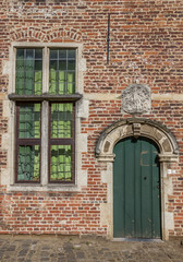 Fototapeta na wymiar Door and window in the old quarter Begijnhof in Leuven