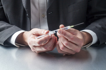 professional holding needle symbol of medical treatment