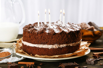 Delicious chocolate cake on table on light background