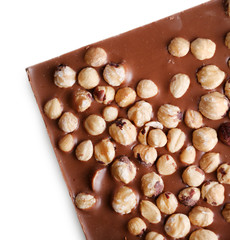 Milk chocolate bar with hazelnuts isolated on white