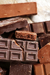 Set of chocolate on wooden table, closeup