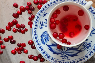 Cranberry tea and berries on a tray