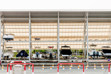 Motorboats on shelves waiting for a maintenance